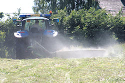 Simon mowing the drive field